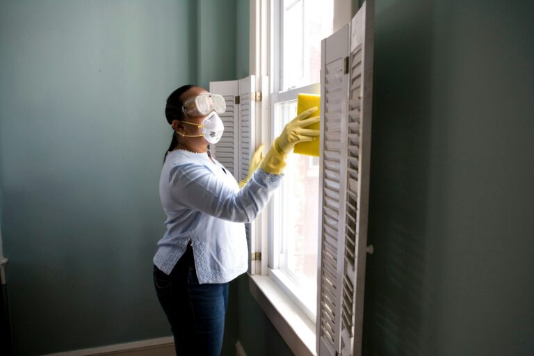Professional window cleaner working safely on a commercial building