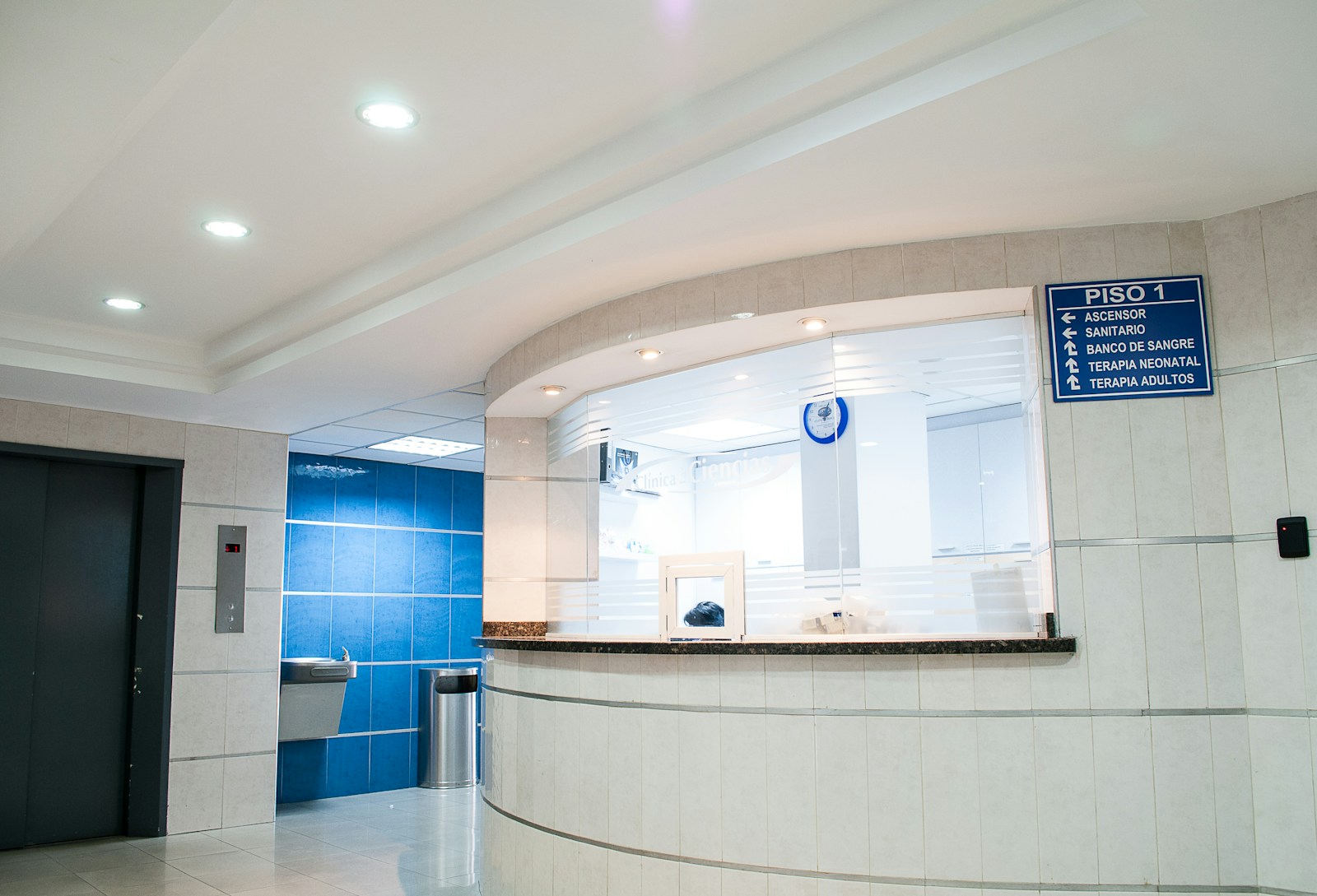 Clean medical waiting room with seating and reception area