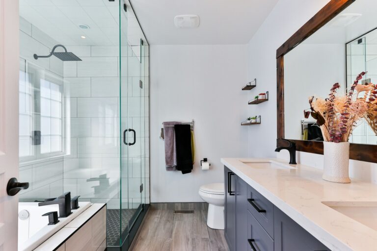 Clean commercial washroom with stocked hygiene facilities